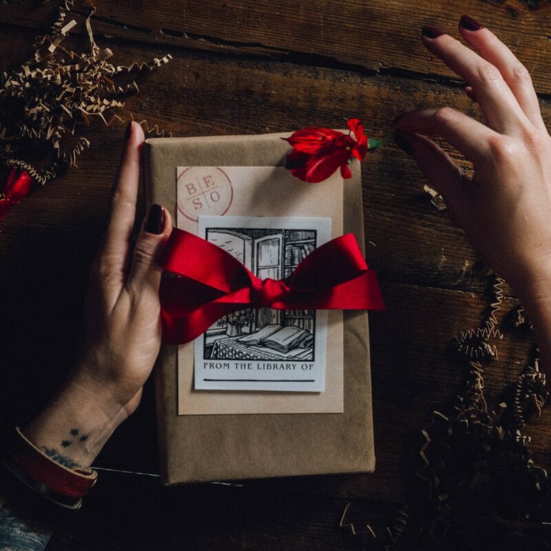 red ribbon on white greeting card